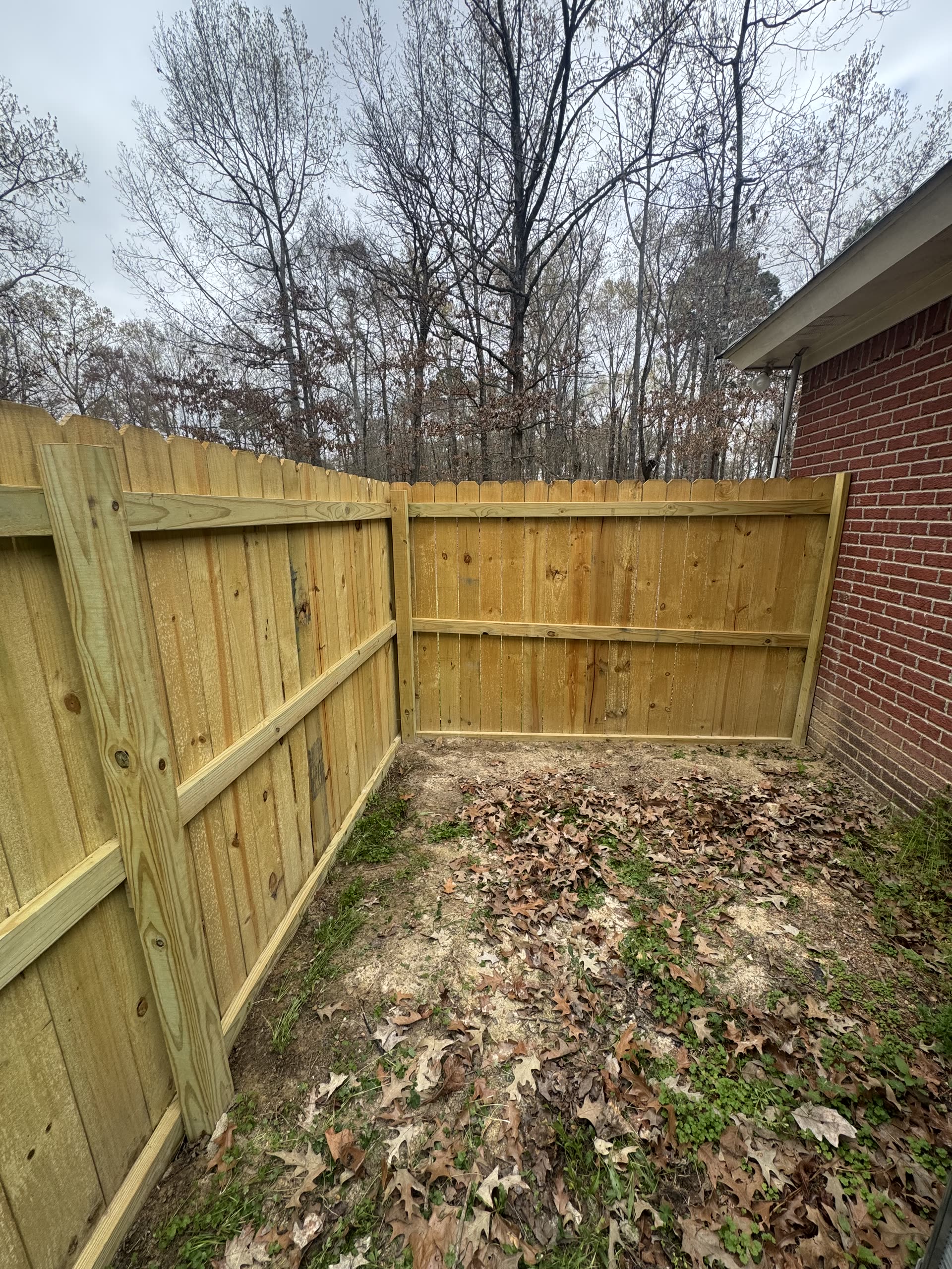 New vertical board privacy fence inside corner in Jackson Metro area