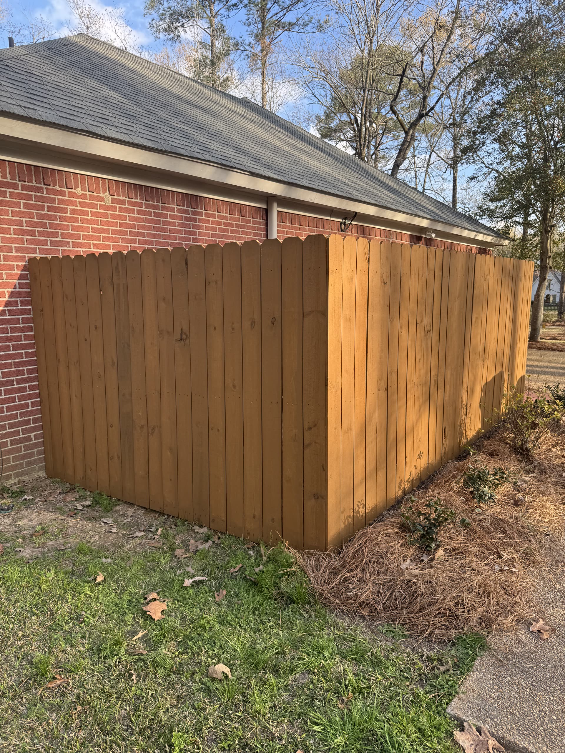 Stained privacy fence installation in Rankin County, Mississippi